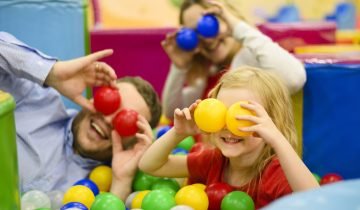 family-covering-eyes-with-balls