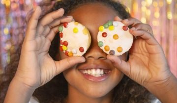 happy-young-pretty-girl-festive-party-holding-cupcakes